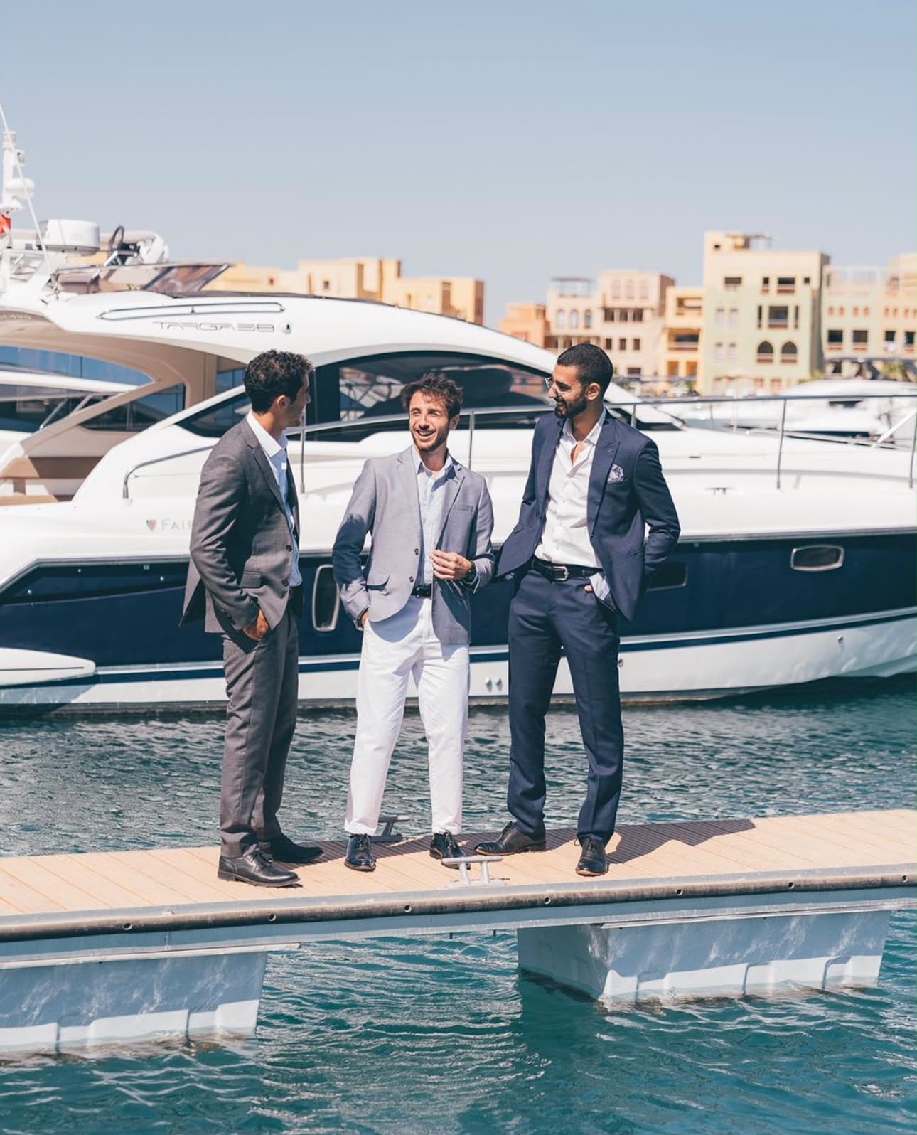 People in conversation at the marina